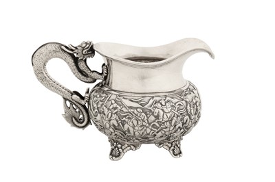 Lot 182 - A mid-19th century Chinese export silver milk jug, Canton circa 1860 by Shan, retailed by Dak Hing