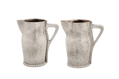 Lot 345 - A pair of Victorian novelty sterling silver milk or cream jugs, London 1887 by William Hutton and Sons