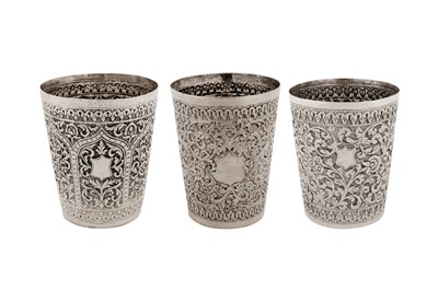 Lot 136 - A group of three late 19th – early 20th century Anglo – Indian unmarked silver beakers, Cutch