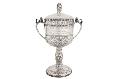 Lot 255 - A large George V ‘arts and crafts’ sterling silver twin handled cup and cover, Birmingham 1927 by A E Jones