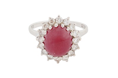 Lot 99 - A RUBY AND DIAMOND CLUSTER RING