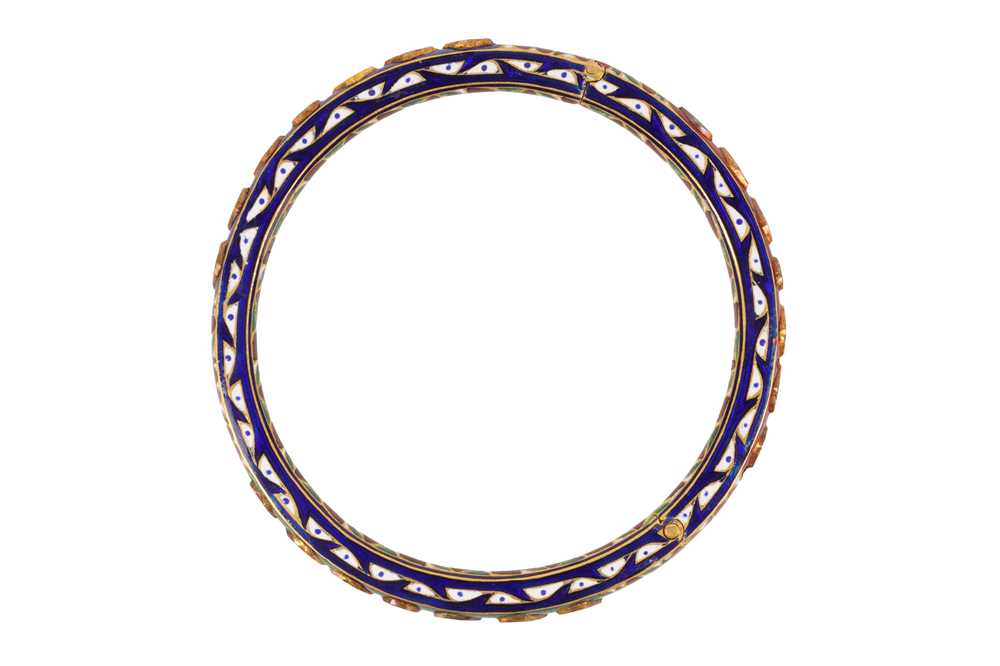 Lot 47 - A GILT AND POLYCHROME-ENAMELLED BANGLE