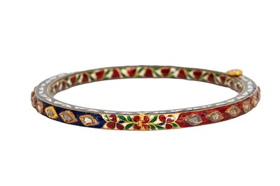 Lot 47 - A GILT AND POLYCHROME-ENAMELLED BANGLE