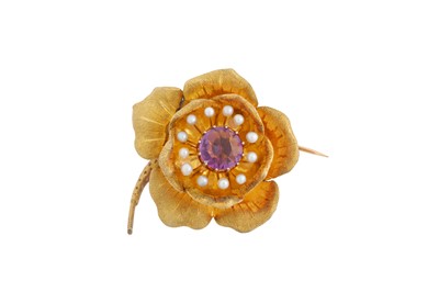 Lot 2 - AN AMETHYST AND SEED PEARL FLOWER BROOCH