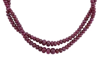 Lot 87 - A TWO-STRAND RUBY BEAD NECKLACE