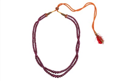 Lot 87 - A TWO-STRAND RUBY BEAD NECKLACE