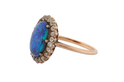 Lot 114 - A BLACK OPAL AND WHITE SAPPHIRE CLUSTER RING