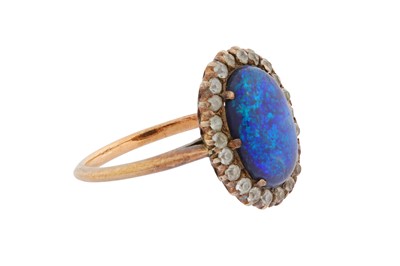 Lot 114 - A BLACK OPAL AND WHITE SAPPHIRE CLUSTER RING