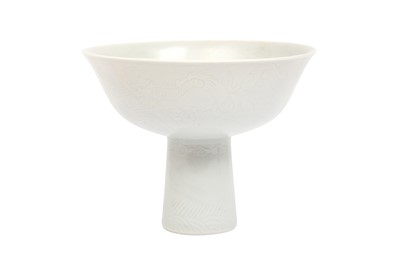 Lot 613 - A CHINESE MONOCHROME INCISED 'DRAGON' STEM BOWL