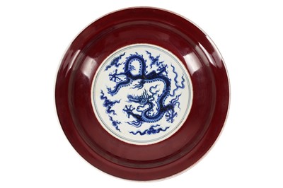 Lot 124 - A CHINESE BLUE AND WHITE RED-GLAZED DISH