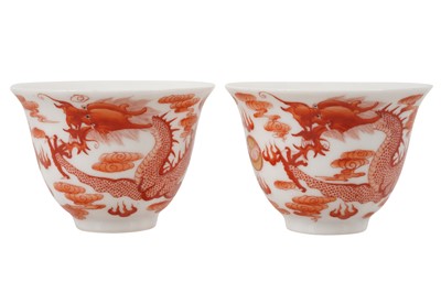 Lot 130 - A PAIR OF CHINESE IRON-RED 'DRAGON' WINE CUPS