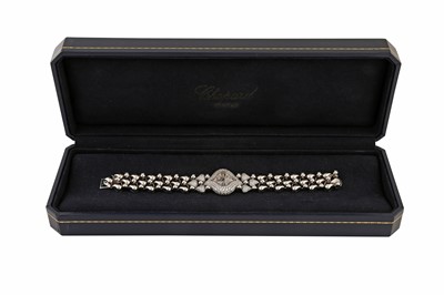 Lot 464 - CHOPARD PUSHKIN BRACELET WATCH - 18K WHITE GOLD AND DIAMONDS