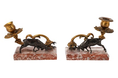 Lot 276 - A PAIR OF ORMOLU CANDLE HOLDERS ON RECTANGULAR MARBLE BASES