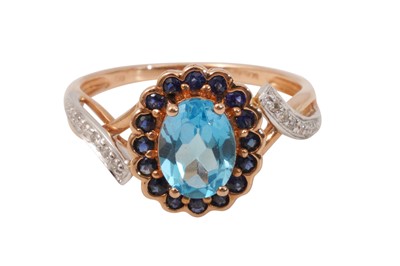 Lot 4 - A TOPAZ, SAPPHIRE AND DIAMOND RING