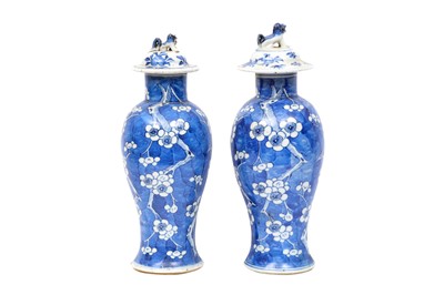 Lot 477 - A PAIR OF CHINESE BLUE AND WHITE VASES WITH COVERS