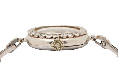 Lot 267 - A LADY'S PLATINUM AND DIAMOND COCKTAIL WATCH