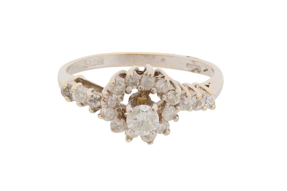 Lot 14 - A 14CT GOLD AND DIAMOND HALO RING, CIRCA 1969