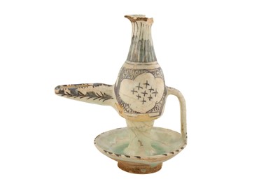 Lot 54 - A GLAZED FRITWARE CERAMIC OIL BURNER/LAMP