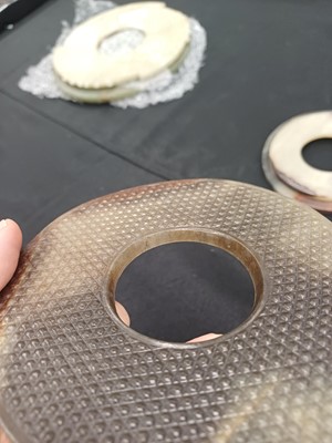 Lot 524 - THREE CHINESE ARCHAISTIC JADE BI DISCS