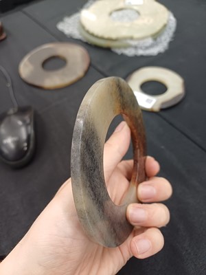 Lot 524 - THREE CHINESE ARCHAISTIC JADE BI DISCS