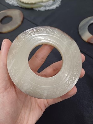 Lot 524 - THREE CHINESE ARCHAISTIC JADE BI DISCS
