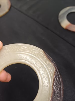 Lot 524 - THREE CHINESE ARCHAISTIC JADE BI DISCS