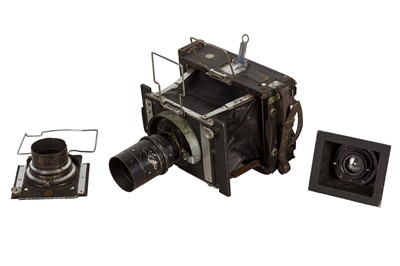 Lot 139 - A Three Lens Van Neck Strut Folding Press Camera Outfit