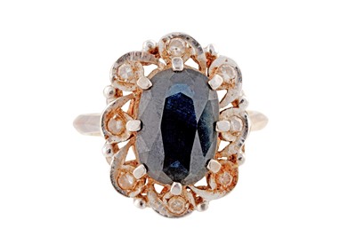 Lot 350 - A SAPPHIRE AND DIAMOND CLUSTER RING, CIRCA 1975