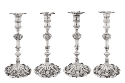 Lot A set of four George III sterling silver candlesticks, London 1765 by Ebenezeer Coker