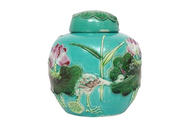 Lot 322 - A SMALL CHINESE POLYCHROME 'LOTUS POND' JAR AND COVER