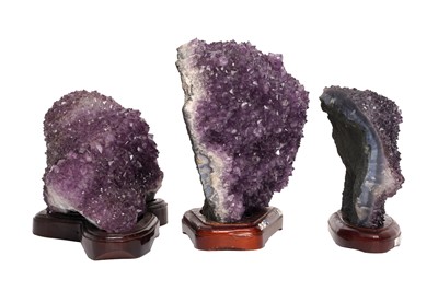Lot 70 - THREE AMETHYST GEODE CLUSTERS ON STANDS