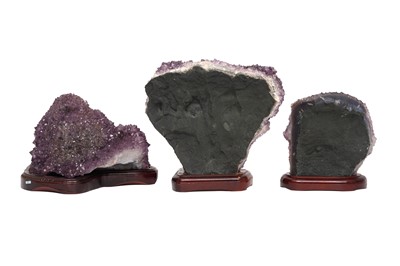 Lot 70 - THREE AMETHYST GEODE CLUSTERS ON STANDS
