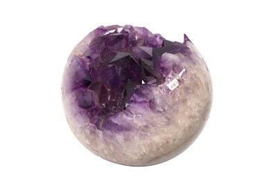 Lot 232 - AN AMETHYST GEODE CLUSTER POLISHED INTO A SPHERE.