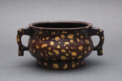 Lot 201 - A CHINESE GOLD-SPLASHED BRONZE TWIN-HANDLED CENSER