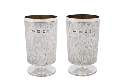 Lot A pair of Elizabeth II modernist sterling silver goblets or footed beakers, London 1966 by Gerald Benney (1930-2008)