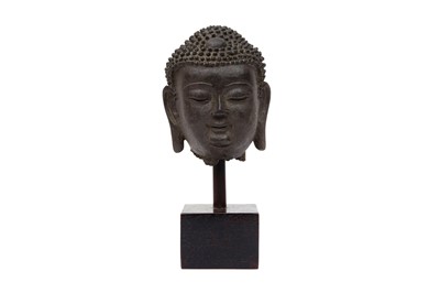 Lot 218 - A CHINESE BRONZE HEAD OF A BUDDHA ON WOOD STAND