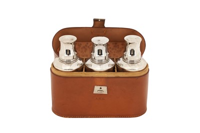 Lot 306 - A SET OF THREE NICKEL PLATED AND GLASS FLASKS