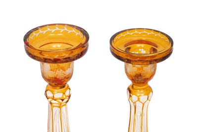 Lot 179 - A PAIR OF BOHEMIAN AMBER FLASH CUT GLASS CANDLE HOLDERS, EARLY 20TH CENTURY