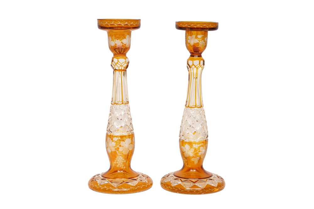 Lot 179 - A PAIR OF BOHEMIAN AMBER FLASH CUT GLASS CANDLE HOLDERS, EARLY 20TH CENTURY
