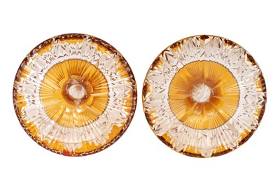Lot 179 - A PAIR OF BOHEMIAN AMBER FLASH CUT GLASS CANDLE HOLDERS, EARLY 20TH CENTURY