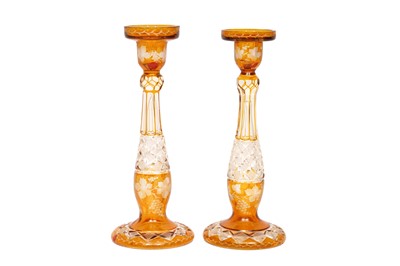 Lot 179 - A PAIR OF BOHEMIAN AMBER FLASH CUT GLASS CANDLE HOLDERS, EARLY 20TH CENTURY