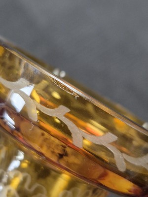 Lot 179 - A PAIR OF BOHEMIAN AMBER FLASH CUT GLASS CANDLE HOLDERS, EARLY 20TH CENTURY