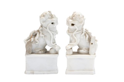 Lot 301 - A PAIR OF CHINESE DEHUA 'LION DOG' INCENSE HOLDERS