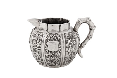 Lot A late 19th century Chinese export silver milk or cream jug, Canton dated 1897, marked Qiao Yuan Sheng, retailed by Wo Shing of Shanghai