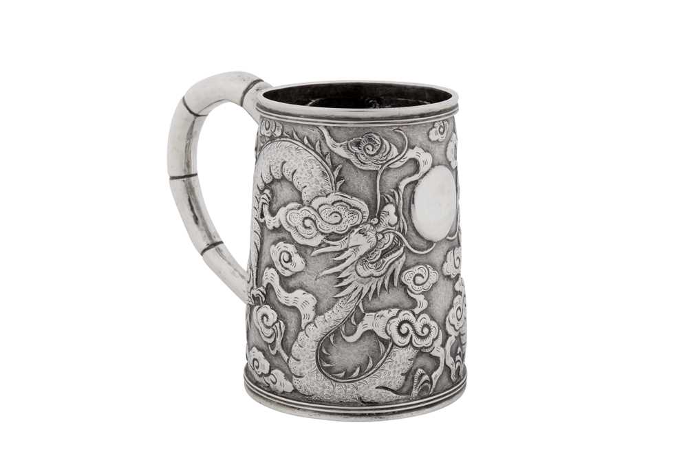 Lot 256 - An early 20th century Chinese export silver small mug, Shanghai circa 1910, marked Ming Ji, retailed by Tuck Chang of Shanghai