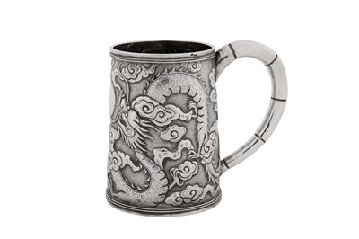 Lot 256 - An early 20th century Chinese export silver small mug, Shanghai circa 1910, marked Ming Ji, retailed by Tuck Chang of Shanghai