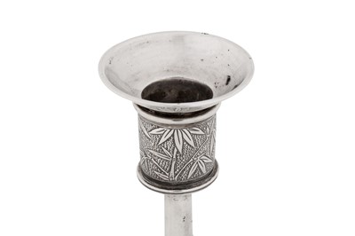 Lot 262 - A pair of early 20th century Chinese export silver candlesticks, Shanghai circa 1920, marked Bi Ji, retailed by Wang Hing of Canton and Hong Kong