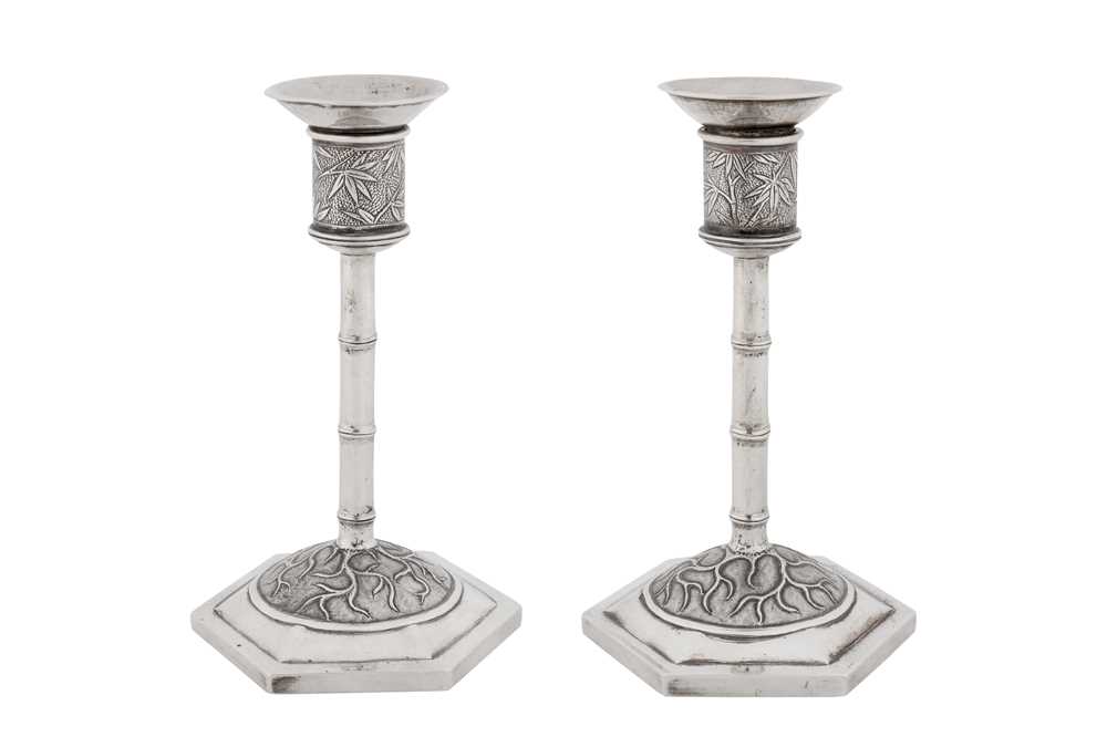 Lot 262 - A pair of early 20th century Chinese export silver candlesticks, Shanghai circa 1920, marked Bi Ji, retailed by Wang Hing of Canton and Hong Kong