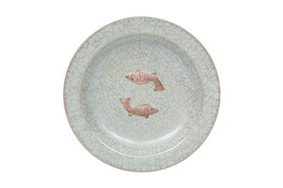 Lot 618 - A CHINESE CRACKLE-GLAZED 'TWIN FISH' DISH