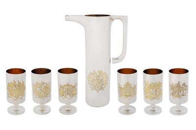 Lot A cased Elizabeth II commemorative parcel gilt sterling silver drinks set, London 1974, designed by Alex Styles and John Churchill for Garrard and Co